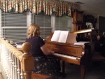 Rebecca playing the piano